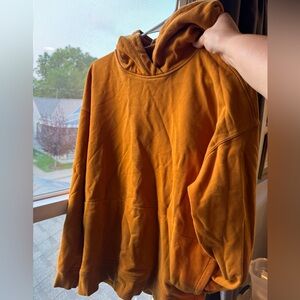 Rust Gold/Mustard Lululemon Hooded Sweatshirt.